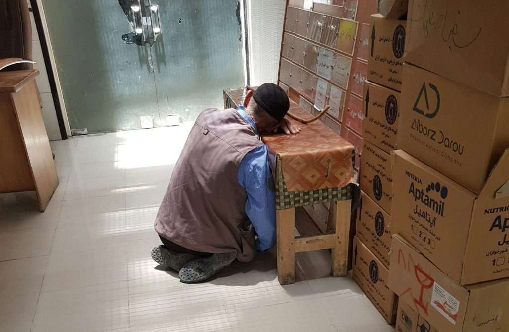man sitting on floor